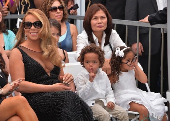 Mariah Carey sits with her twins Moroccan and Monroe Cannon at Hollywood Walk Of Fame Star Ceremony