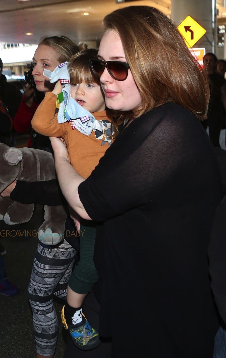adele touches down at lax with son angelo adele at lax with son angelo