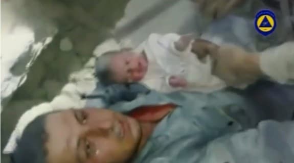 2 week old baby rescued from rubble in Aleppo