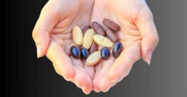 multivitamin in woman's hands