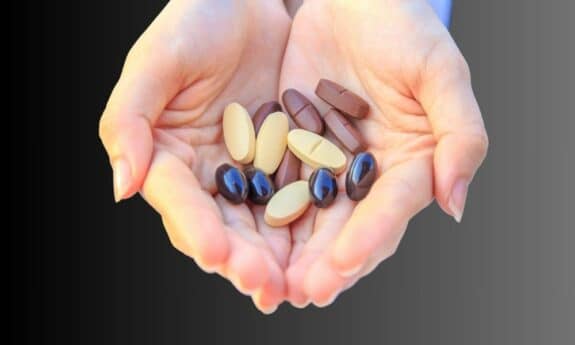 multivitamin in woman's hands