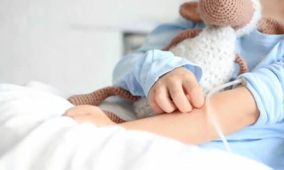 child in hospital bed