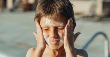 A Boy with Sunscreen on His Face