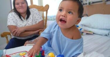 19-month-old Adriano Wah with his mom