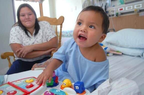 19-month-old Adriano Wah with his mom