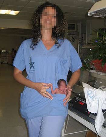 Nurse photographed with premature baby in her pocket