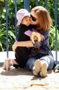 Isla Fisher and her daughter Olive Cohen play at the park