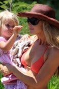 denise richards and her daughters enjoy the beach and a local parrott in maui