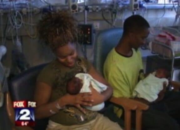 mom and day holding their babies in the NICU