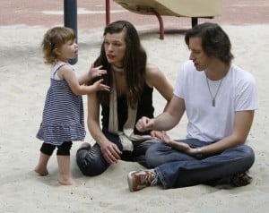 Milla Jovovich with boyfriend Paul Anderson and daughter Ever