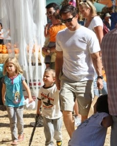 Mark Wahlberg and his two oldest children Ella and Michael pick pumpkins
