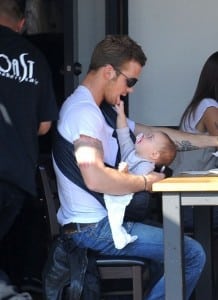 Cam Gigandet holds his daughter Everleigh while he has lunch