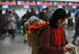 Mom waits for her flight at the International Airport in Urumqi, China