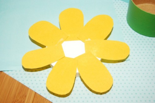 The first row of petals glued onto the box