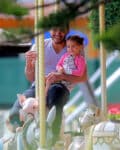 Emme Anthony with security on the carousel