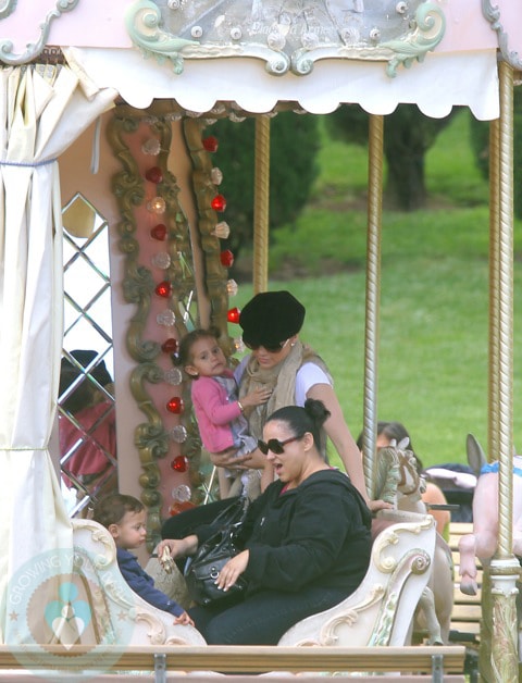 Jennifer Lopez Holding Emme, while a nanny looks after Max
