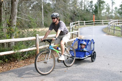 Mom riding bike with son