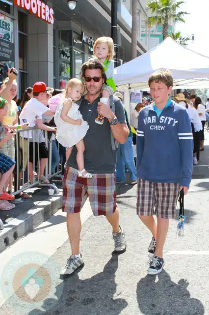 Dean McDermott with son Jack while carrying Stella and Liam