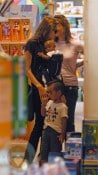 Angelina Jolie wearing daughter Zahara while holding Maddox