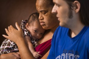 Erika Johnson and Blake Sinnett with their daughter