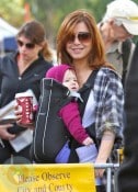 Alyson Hannigan wearing daughter Satyana