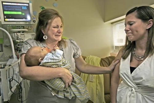 Four-month-old Max Robinson was strong enough to leave Overland Park Regional Medical Center on Tuesday. His mother, Jennifer Robinson (left), was joined by Nicole Hendrix, whose donation of breast milk gave strength to Max. Four-month-old Max Robinson was strong enough to leave Overland Park Regional Medical Center on Tuesday. His mother, Jennifer Robinson (left), was joined by Nicole Hendrix, whose donation of breast milk gave strength to Max.