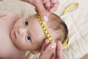 child getting head measured