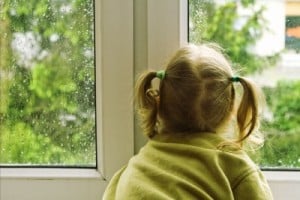 girl looking out a window