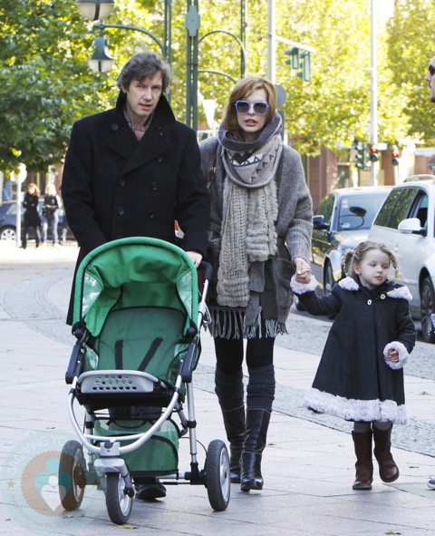 Milla Jovovich with husband Paul and daughter Ever