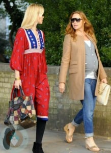 A pregnant Stella McCartney strolling with Claudia Schiffer