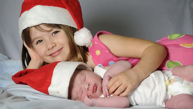 Cayleigh Erasmus with newborn brother Davian who were both born on Christmas Day
