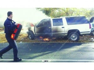 Firefighters attending to the vehicle