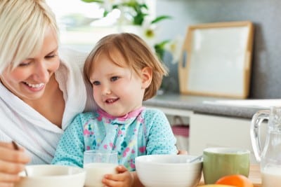 Mom and daughter sharing breakfast