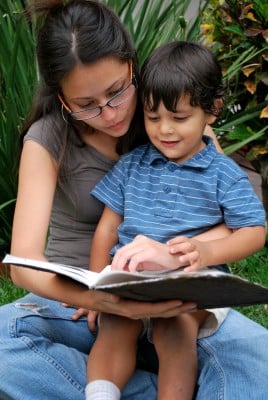 toddler and mom reading