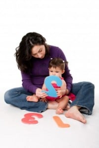 mom and toddler practicing numbers