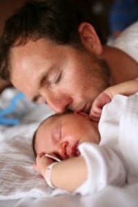 Dad co-sleeping with son