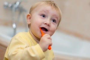 toddler brushing his teeth