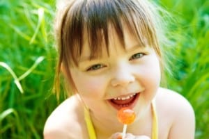 Little Girl eating Candy