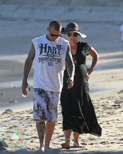 An expectant Pink and husband Carey Hart