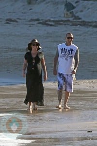 An expectant Pink and husband Carey Hart