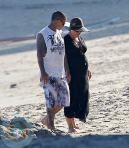 An expectant Pink and husband Carey Hart