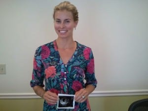 Pregnant Niki Taylor holding her sonogram