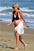 A pregnant Tori Spelling at the Beach