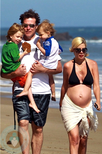 A pregnant Tori Spelling with husband Dean McDermott and kids Liam and Stella