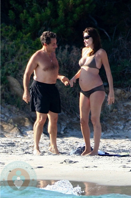 A pregnant Carla Bruni and husband Nicolas Sarkozy on Fort de Brégançon beach