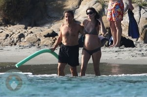 A pregnant Carla Bruni and husband Nicolas Sarkozy on Fort de Brégançon beach