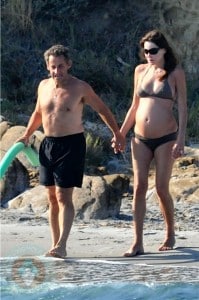 A pregnant Carla Bruni and husband Nicolas Sarkozy on Fort de Brégançon beach