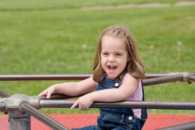 Little girl on the merry go round