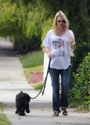 A pregnant January Jones walks her dog