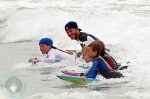 David Beckham surfing with his son Brooklyn, Romeo and Cruz